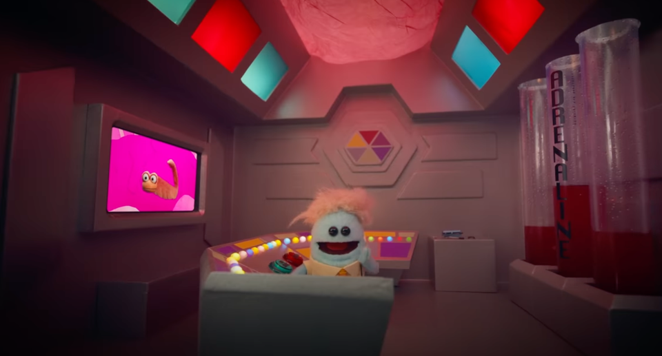 Screenshot from the video on Anxiety showing a muppet like character in a control room