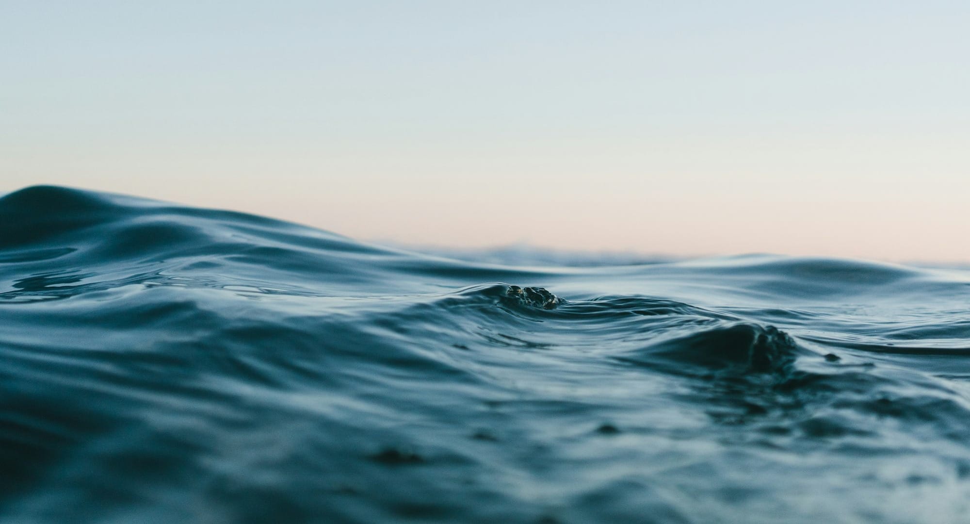 body of water under sky