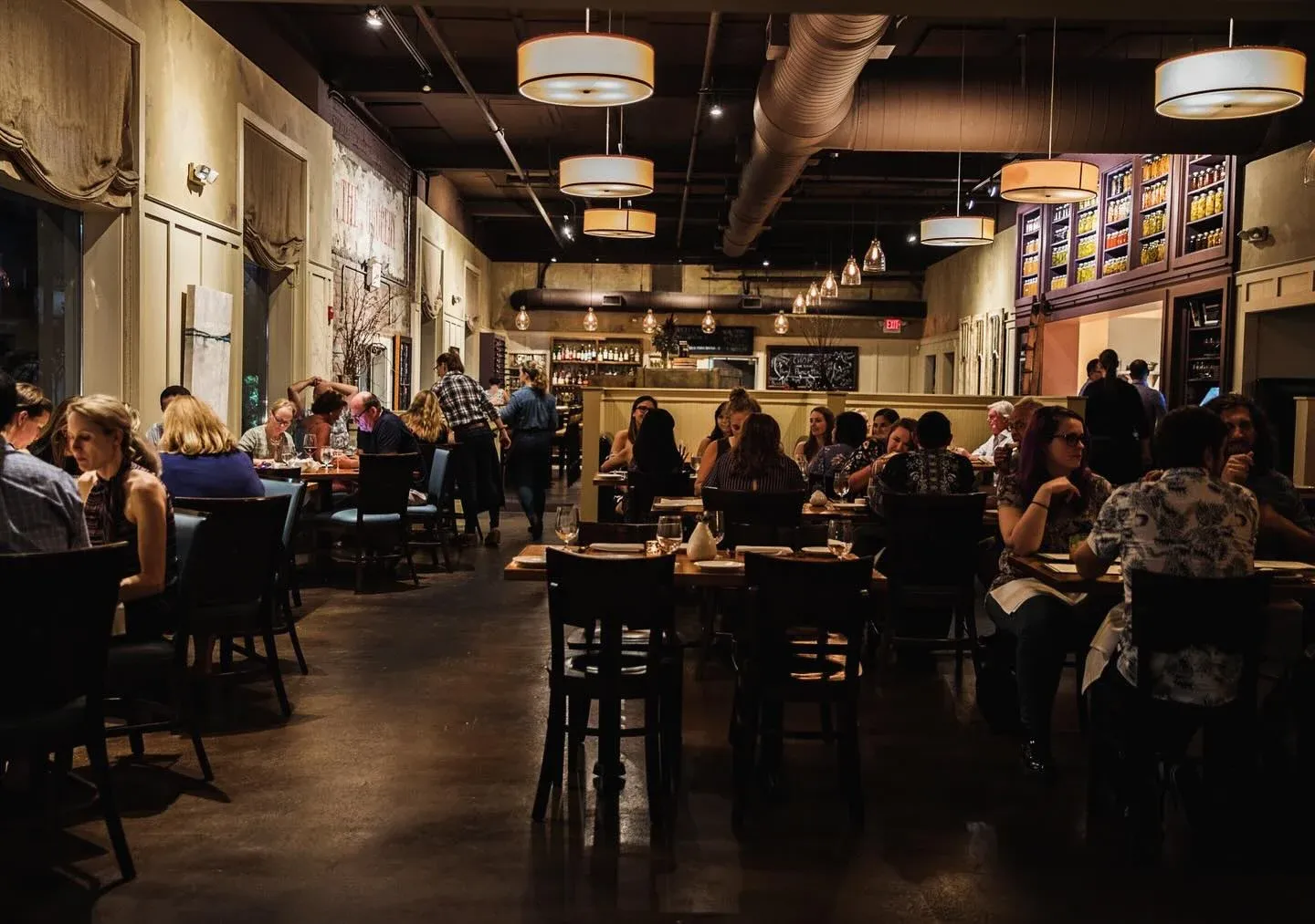 a restaurant with people in visit Charleston sc.