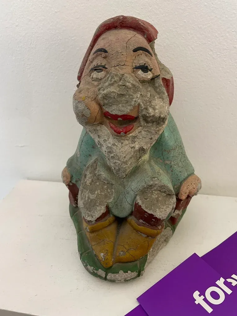 a gnomo in the museum of broken relationships.