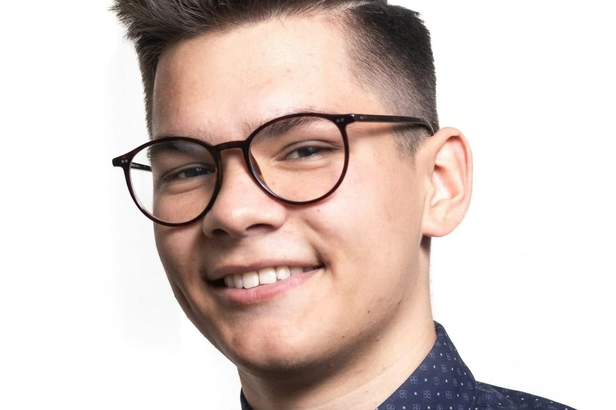 Young man with boyish features, expressing a wish to look his age and achieve a more mature, balanced appearance.