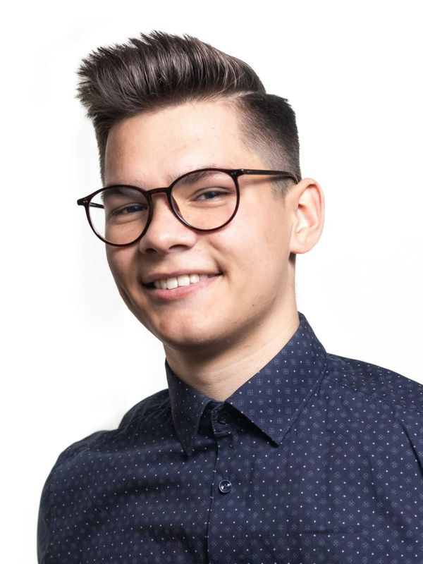 Young man with boyish features, expressing a wish to look his age and achieve a more mature, balanced appearance.