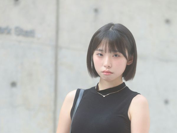 Young woman looking slightly anxious, capturing her apprehension, illustrating common fear of injections.