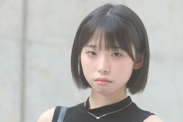Young woman looking slightly anxious, capturing her apprehension, illustrating common fear of injections.