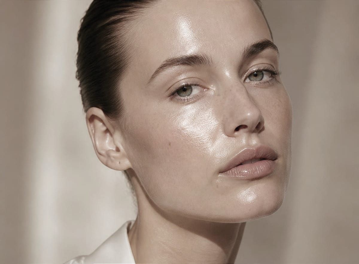 A model with bright, glowing skin following a luxury facial treatment at a top medspa in Beverly Hills.