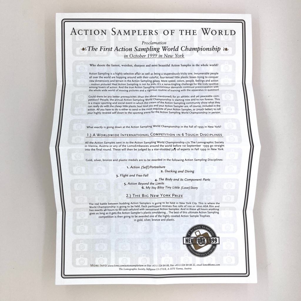 Rear of the poster with information addressing the Action Samplers of the World, and giving information on The First Action Sampling World Championship in October 1999 in New York. 
