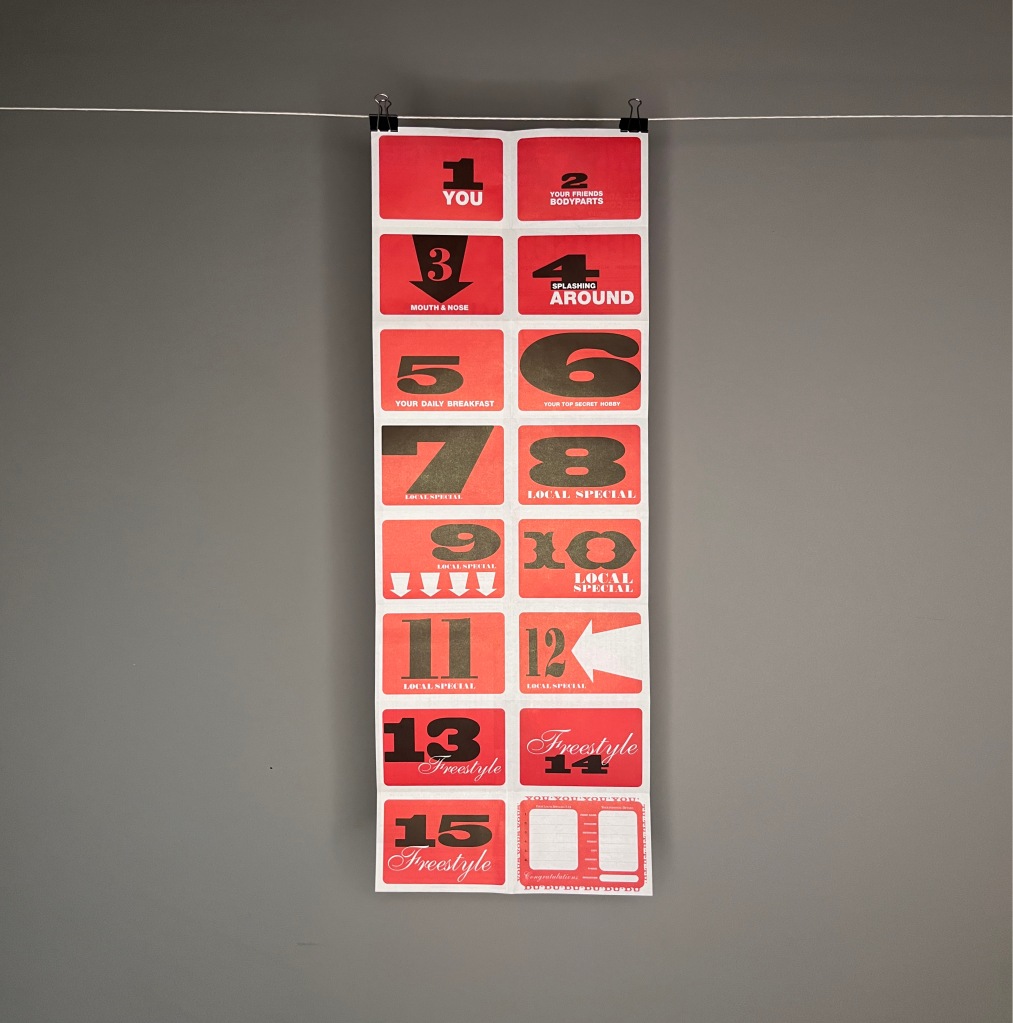 A typographic red white and black long poster with 16 rectangles, each with a number and a prompt for what sort of image you should stick on. Like, You, Splashing around, Local special, and Freestyle. The 16th space is for your personal details 