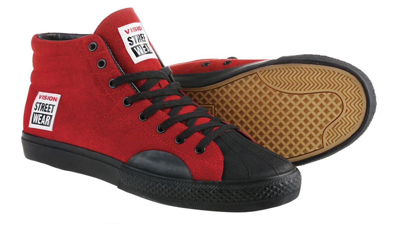 A pair of red suede Vision Street Wear high top skate shoes on a white background. 