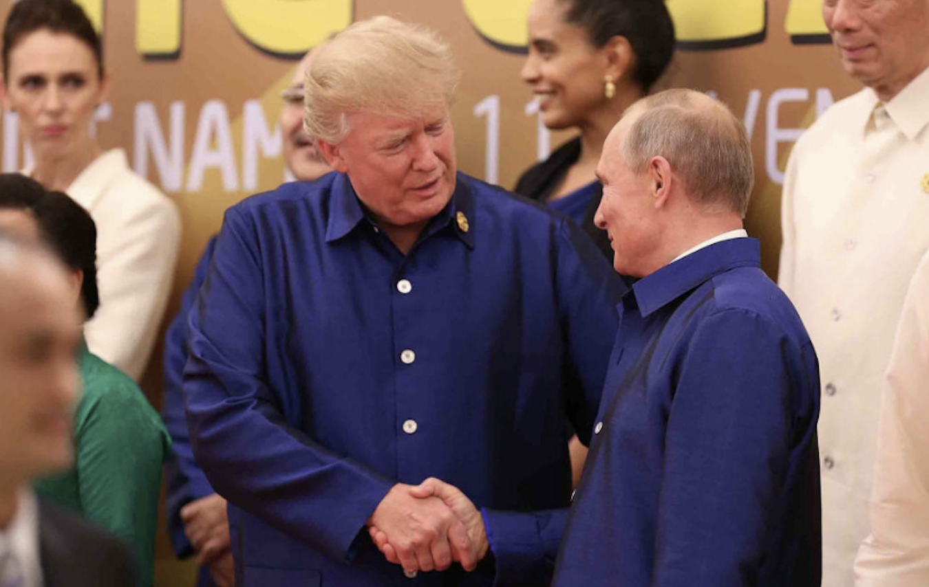 Trump and Putin shaking hands in Vietnam in 2017