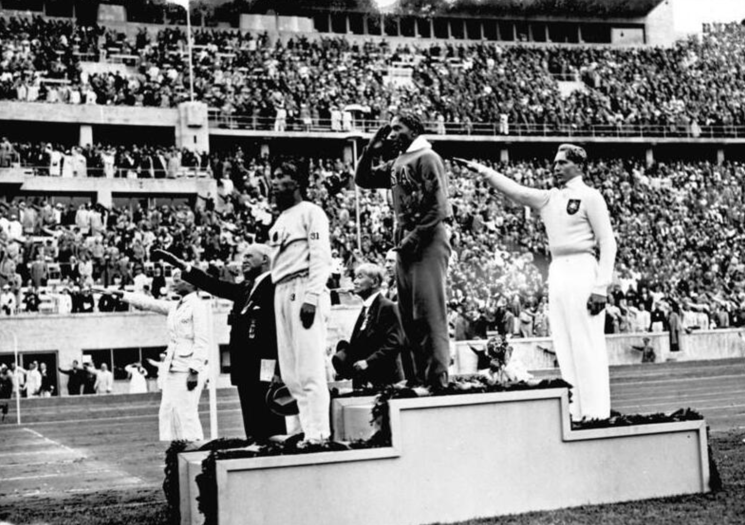 Jesse Owens accepts the Gold Medal for the Men's Long Jump, 1936 Berlin Olympics