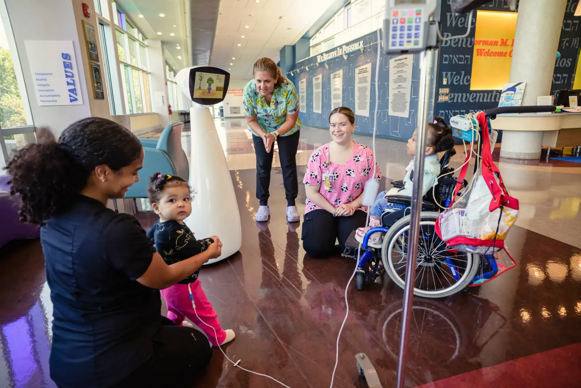 Robin the socially assistive robot interacting with pediatric patient in hospital setting at St. Mary’s