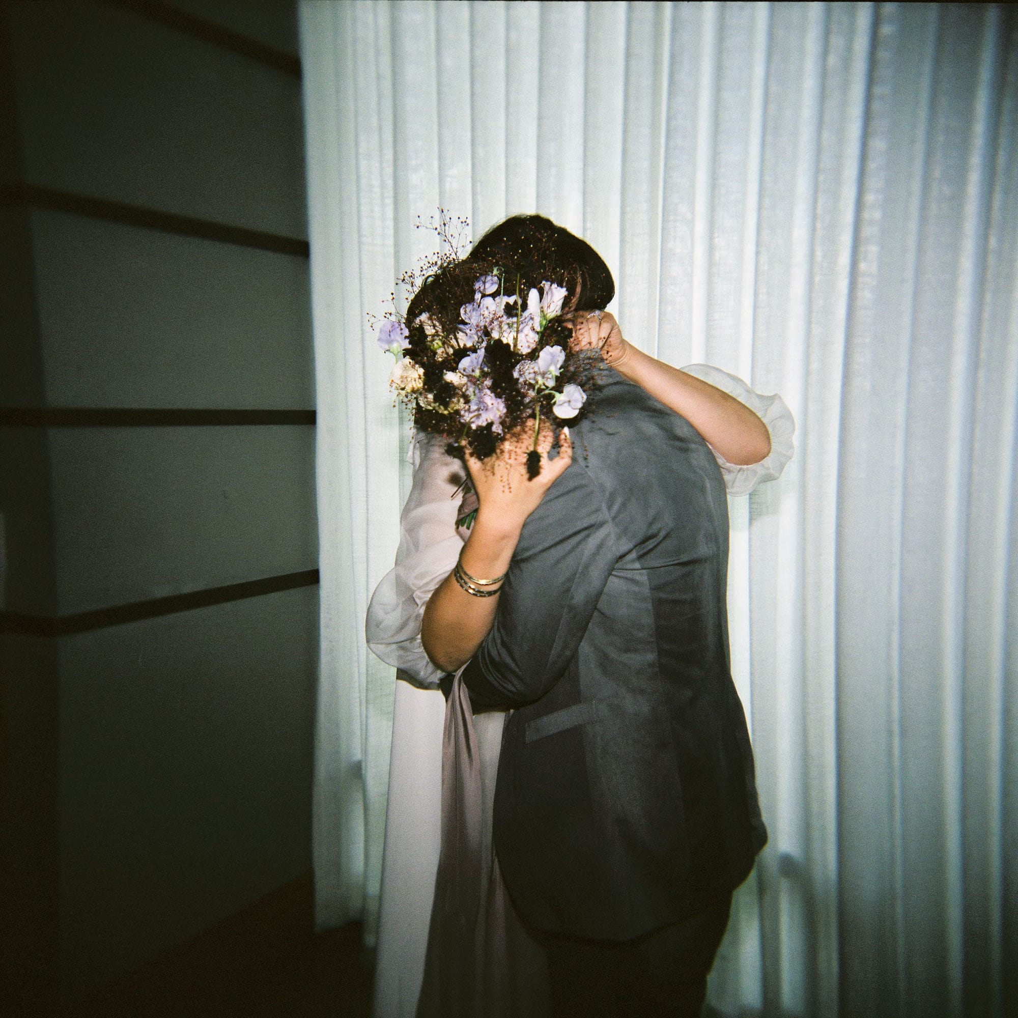 Bride and groom embracing after their wedding ceremony.