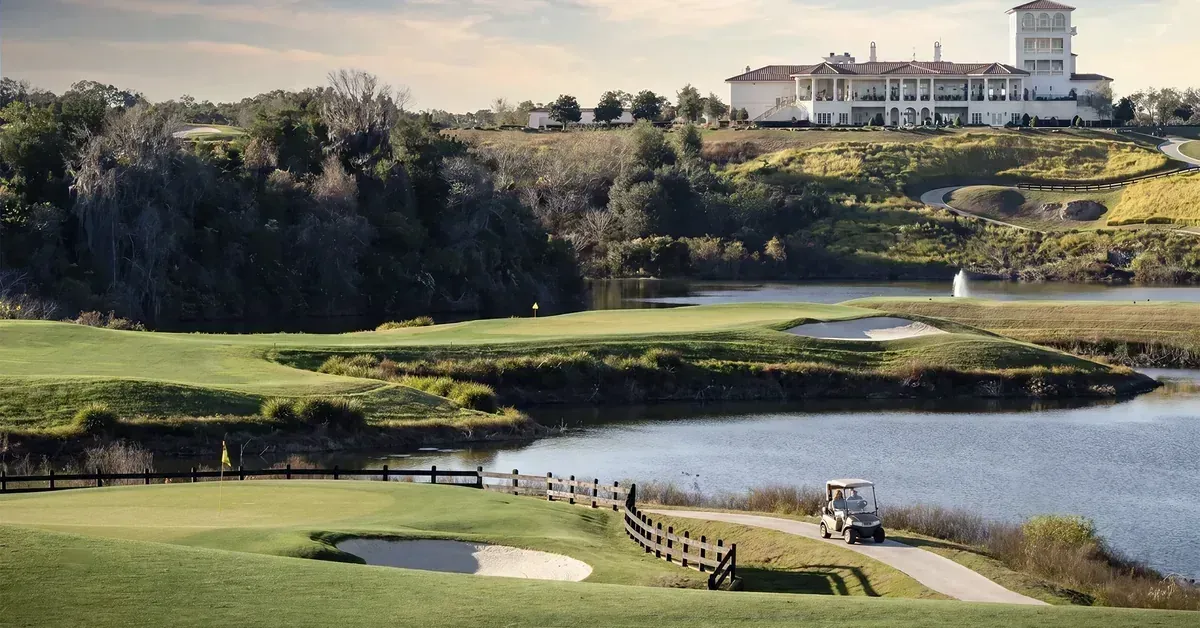 Bridge and clubhouse view at The Club at Iron Lake in Ocala, Florida