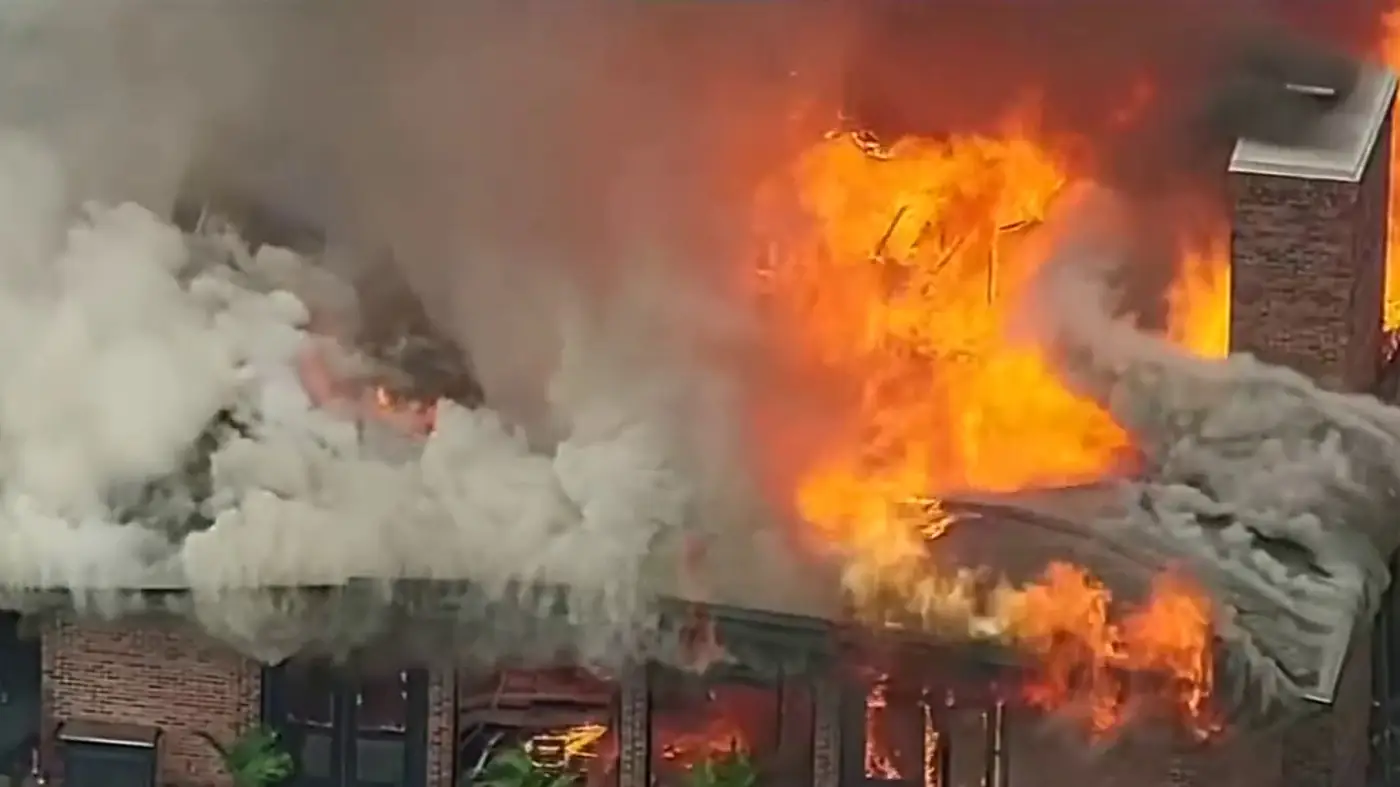 Aerial view of smoke rising from Lochmoor Club clubhouse in Grosse Pointe Woods, Michigan