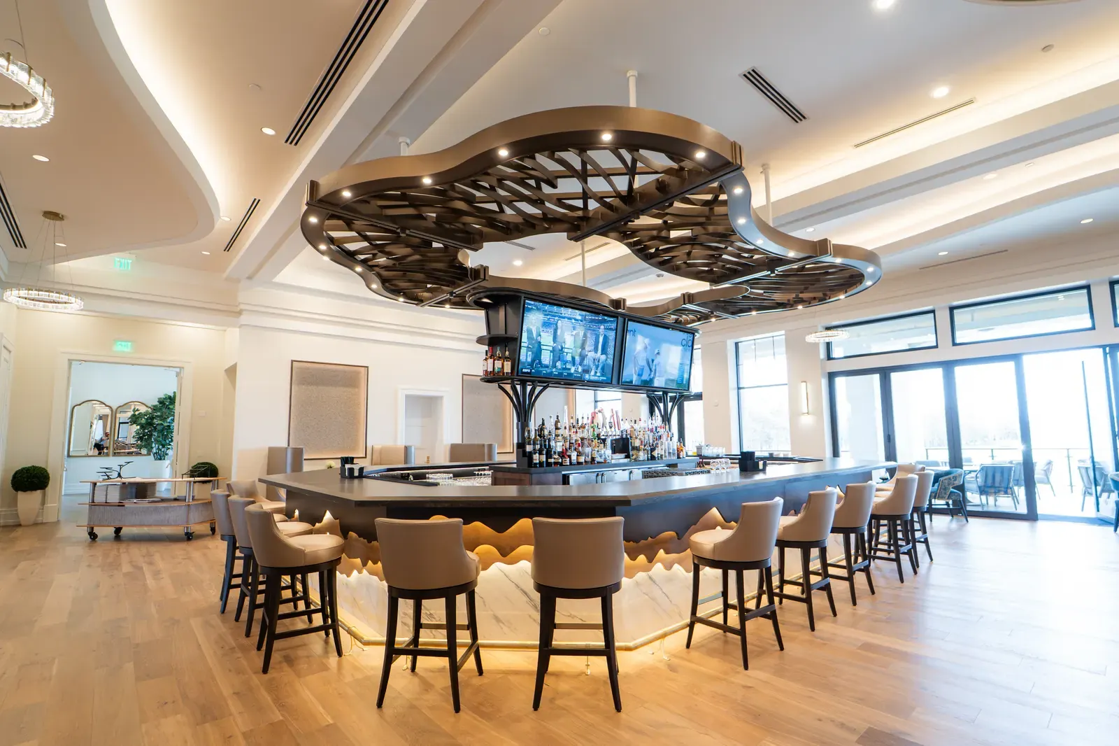 Members’ wraparound bar at The Club at Olde Cypress renovated clubhouse in Naples, Florida