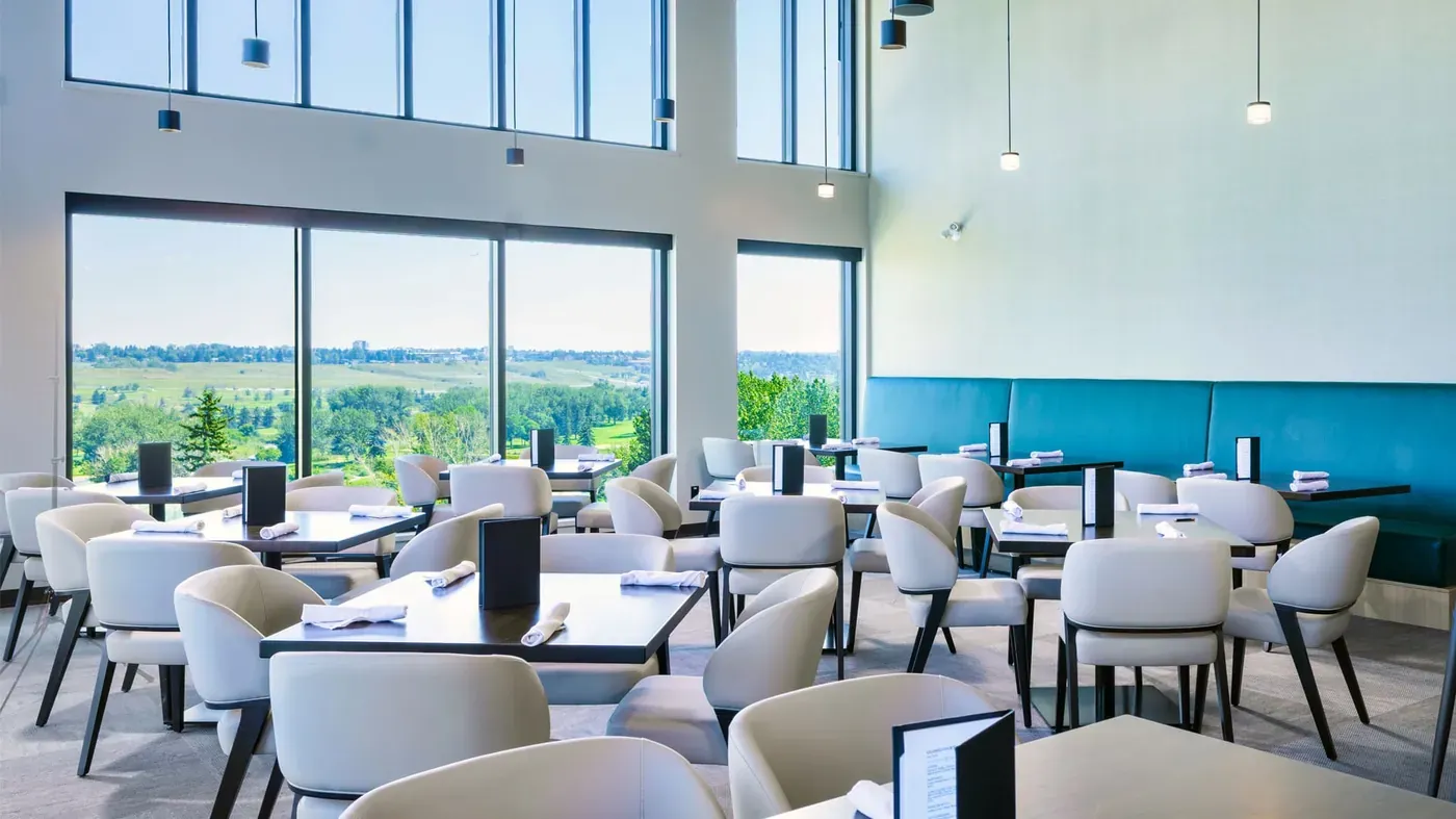 Restaurant and wraparound windows inside The Winston Golf Club clubhouse