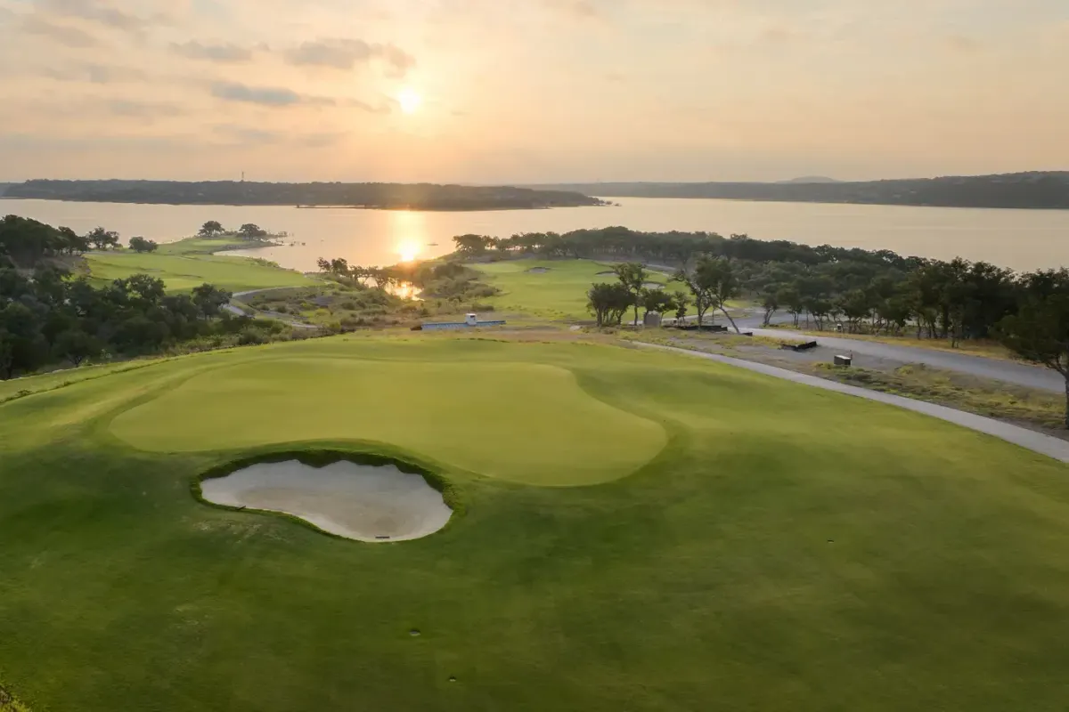 Golf green and Lake Travis shoreline at Travis Club near Austin, Texas