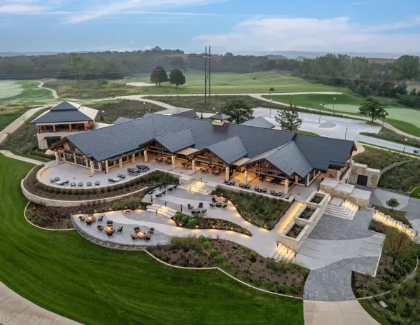 Renovated Quarry Oaks Golf Club clubhouse in Ashland, Nebraska, at dusk overlooking the course