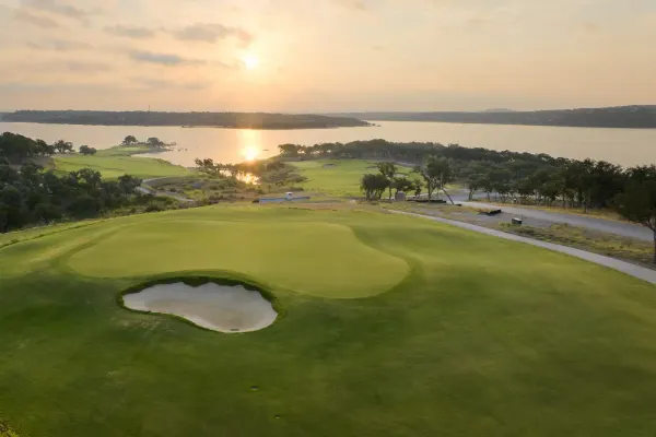 Golf green and Lake Travis shoreline at Travis Club near Austin, Texas