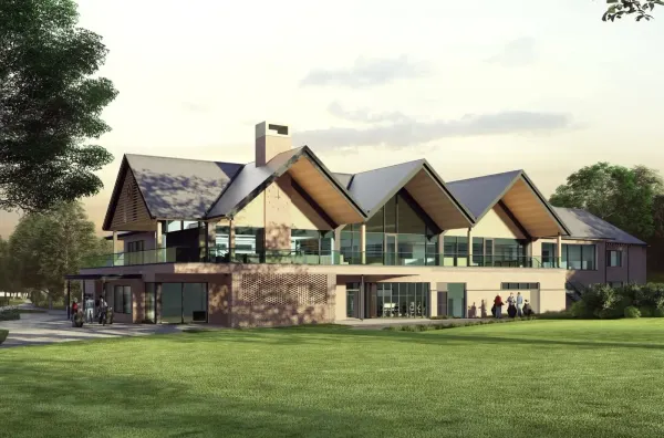 Architect's rendering of the new Woodhall Spa clubhouse: red brick and glass, gabled slate roofs over a glazed terrace, a brick chimney, and golfers with bags.