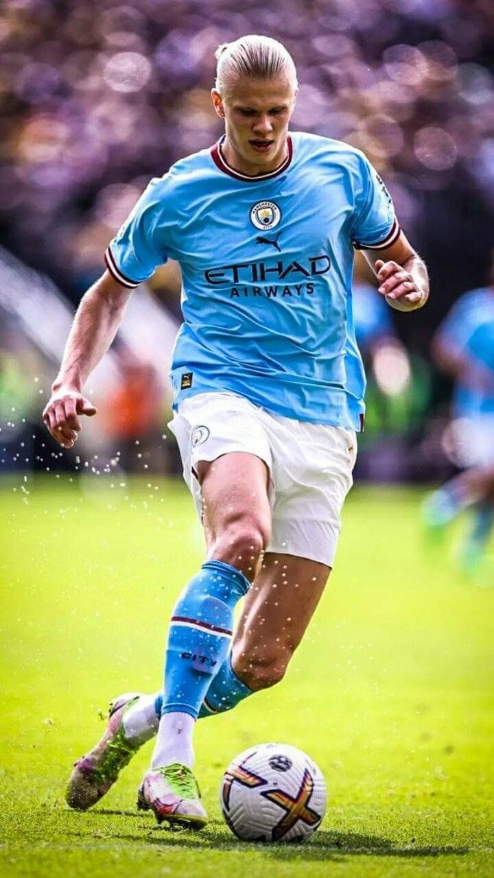 erling haaland football player from norway dribbling the ball