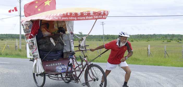 Chinese farmer pedaling his rickshaw to Brazil to celebrate the Olympic Spirit