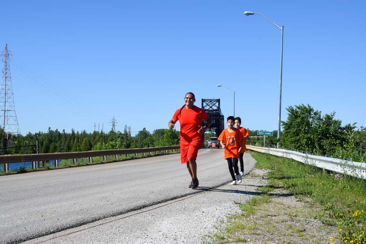 Michael MJ Eshkawkogan runs from Wiikwemkoong to Spanish