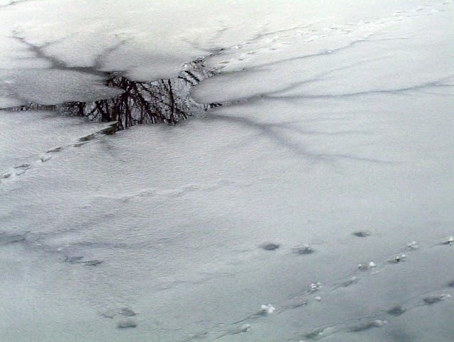 Snowmobile goes through thin ice near McGregor Bay