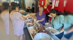 Pig roast celebrates workers, volunteers’ herculean efforts to prepare powwow grounds