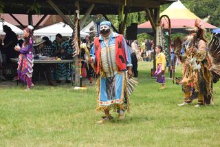 Dancers of all styles make their way around the Aundeck Omni Kaning powwow arena. This powwow has been proclaimed by organize