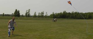 Little people sometimes need a bit of a helping hand while flying their kites. Luckily this dad was on hand to assist in keep