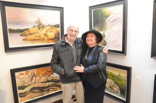 Artist Ivan Wheale and Perivale Gallery owner Shannon McMullan pose during previous opening. This year’s collection features