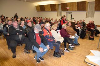 Packed Providence Bay Hall challenges closure decisions
