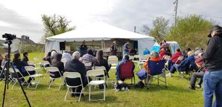 Dr. Alan Corbiere speaks about the 1836 ceremonial pipe while Naomi Recollet of the Ojibwe Cultural Foundation gets ready to