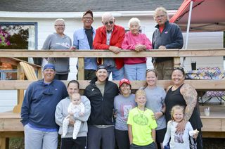 Three generations of resort owners greet three generations of clients