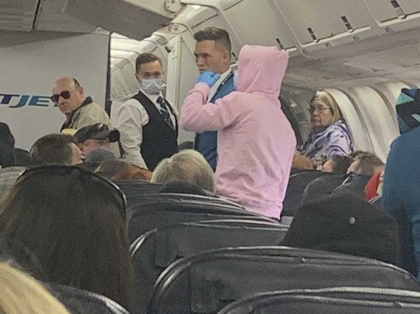 Island couple on plane with coronavirus hoaxer as vacation flight turned back
