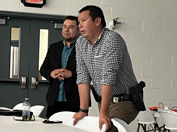 Detective Sergeant Todd Fox, left, and Detective Constable Ed Simon with UCCM Anishinaabe Police discuss human trafficking kn