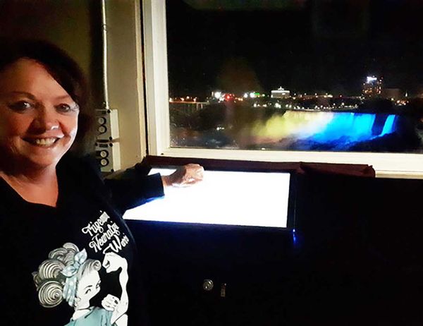Island resident helps bring awareness of rare disease by lighting up Niagara Falls in teal