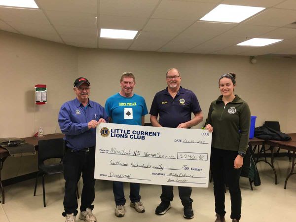 Catch the Ace committee members Lion Mike Dubreuil, Rick Thurston and Lion Bruce Burnett present a cheque to Jessica Summers.
