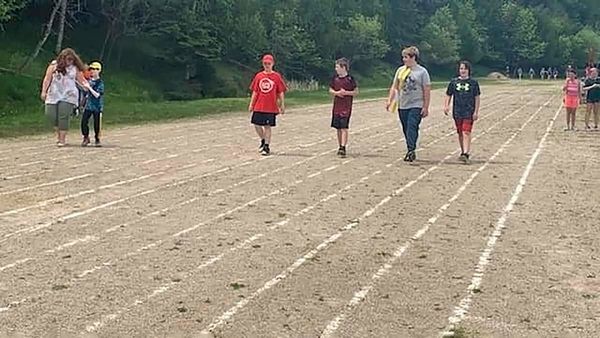Charles C. McLean students help a pal win his ribbon