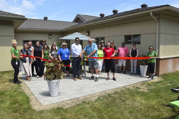 Mnaamodzawin Health Services Inc. executive director Craig Abotossaway and board chair Kevin Mossip cut the ribbon outside on