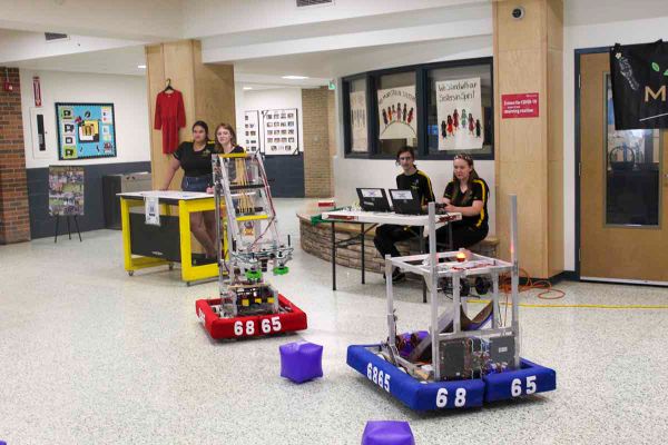 From left, MSS students Jocelyn Kuntsi, Alex Wilson-Zegil, and robotics team drive members Ryan Kuntsi and Nevaeh Harper pres
