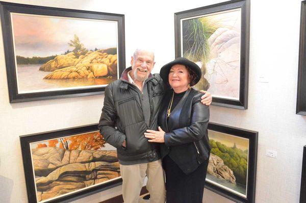 Artist Ivan Wheale and Perivale Gallery owner Shannon McMullan pose during previous opening. This year’s collection features