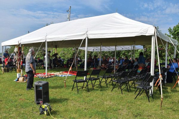 Pipe carriers and elders gather above Manitowaning Bay to honour pipes