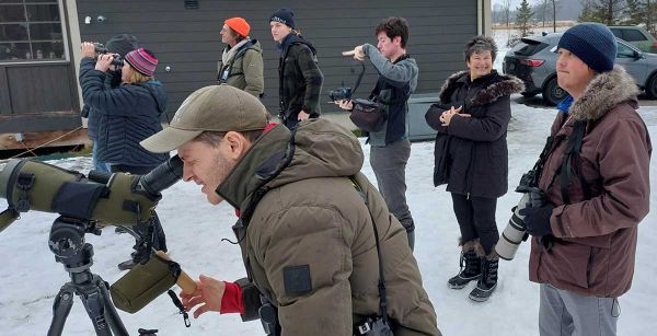 people outdoors taking photos
