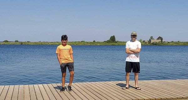 Three  youths work swiftly to rescue swimmer in distress