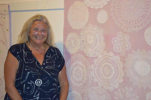 Time features prominently throughout the exhibit. These doilies are an example having been donated to the artist throught the
