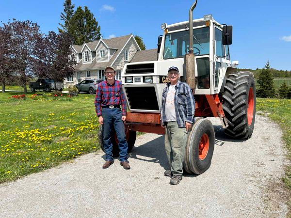 RIGHT AT HOME—Father and son Lyle and Johannes Renecker, right to left, have moved to their new farm in Tehkummah on the Blue