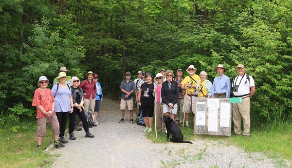 The Wagg’s Woods Trail committee along with other interested parties are shown at the entrance to the trail. photo by Maggie