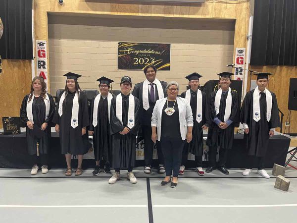 The Wiikwemkoong High School Class of 2023 join Ogimaa Rachel Manitowabi, centre, they include: Jonas Assinewai, Marcus Beaud